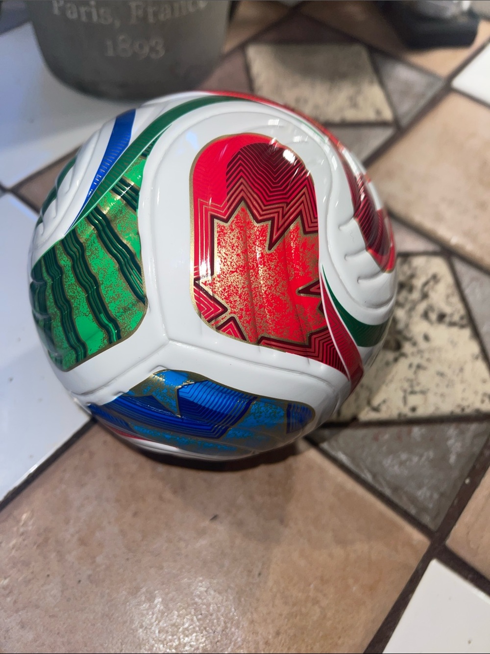 White Decorative Soccer Ball Art Piece with Red, Green, Blue Panels